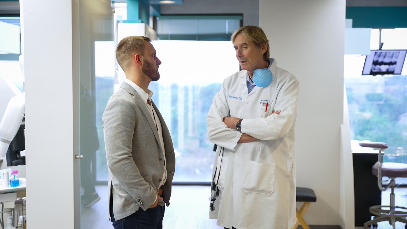 A McLerran & Associates advisor in conversation with Dr. Mark Sweeney at his Austin dental practice.